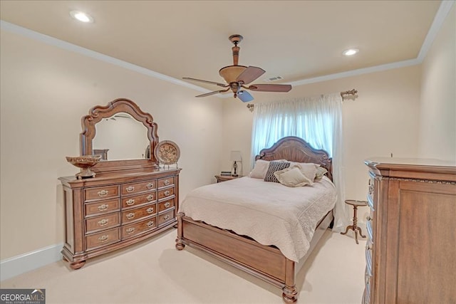 carpeted bedroom with ceiling fan and crown molding