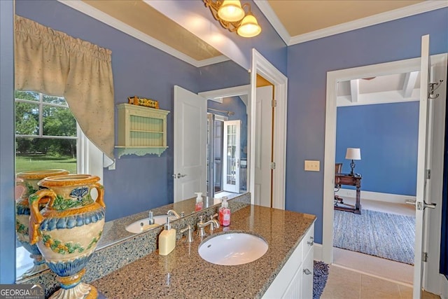 bathroom featuring ornamental molding, vanity, and tile patterned flooring