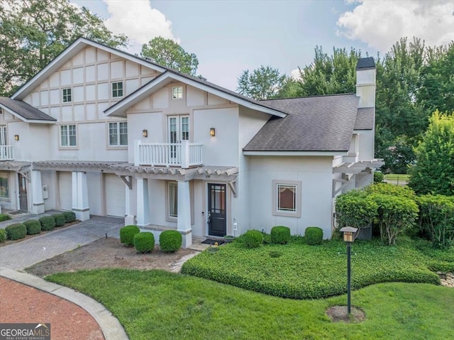 view of front of home with a garage and a front yard