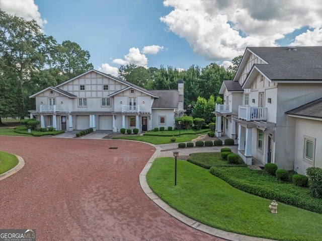 view of front of home featuring a garage and a front yard