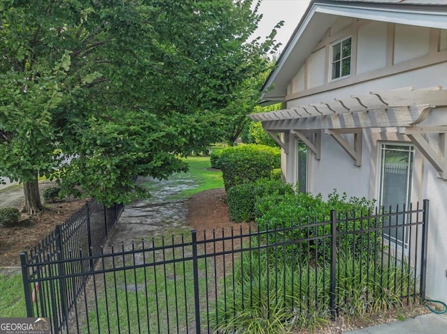 view of home's exterior with a pergola