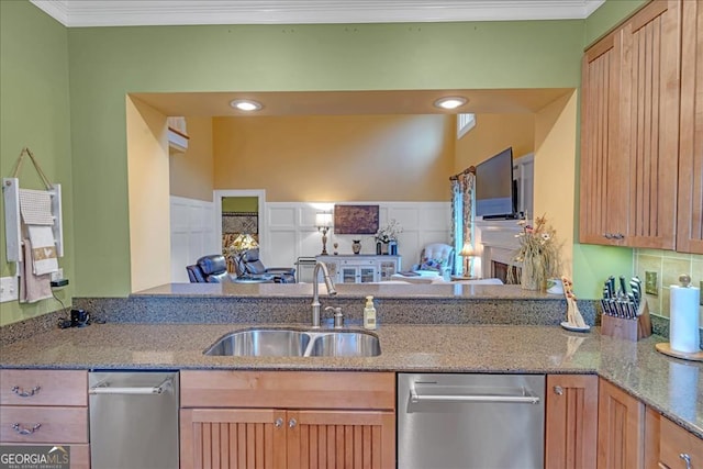 kitchen featuring crown molding, stone countertops, sink, and dishwasher