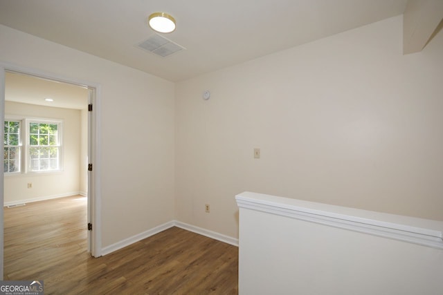 empty room with hardwood / wood-style floors