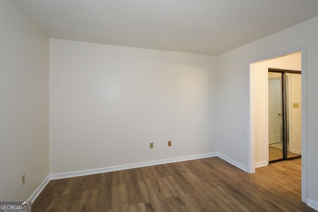 empty room featuring hardwood / wood-style floors