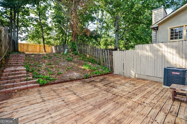 wooden deck featuring central AC unit