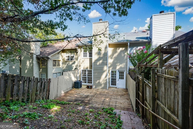 rear view of house with central air condition unit