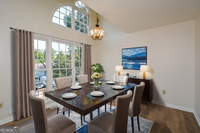 dining room featuring an inviting chandelier and hardwood / wood-style floors