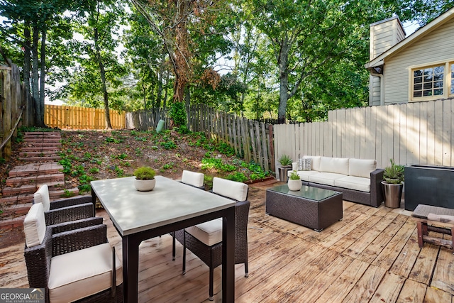 view of patio featuring a wooden deck and an outdoor hangout area