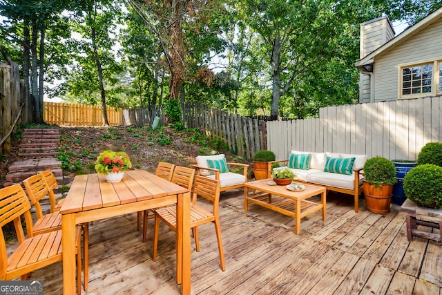 wooden deck with an outdoor hangout area