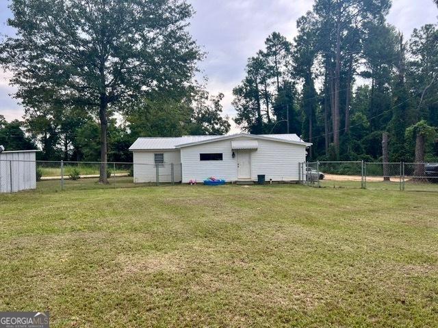 view of outdoor structure featuring a fenced backyard