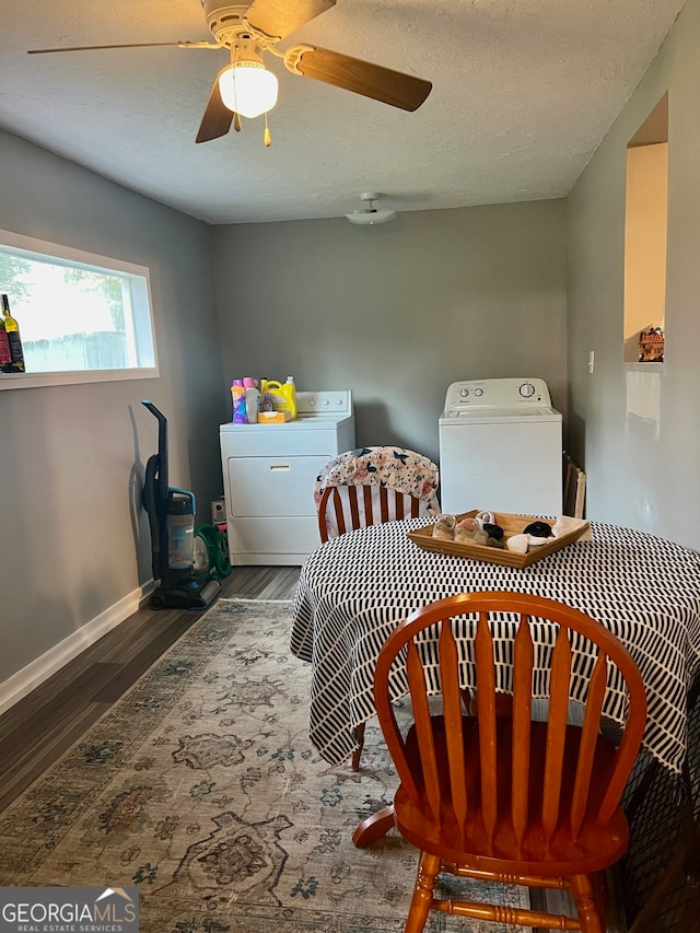 sitting room featuring ceiling fan, dark hardwood / wood-style flooring, a textured ceiling, and separate washer and dryer