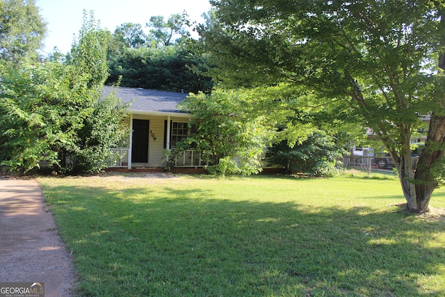 view of front of property with a front yard and a porch