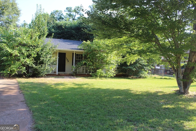 obstructed view of property featuring a porch and a front yard