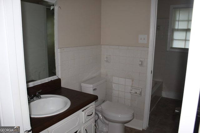 full bathroom with vanity, separate shower and tub, tile walls, toilet, and tile patterned floors