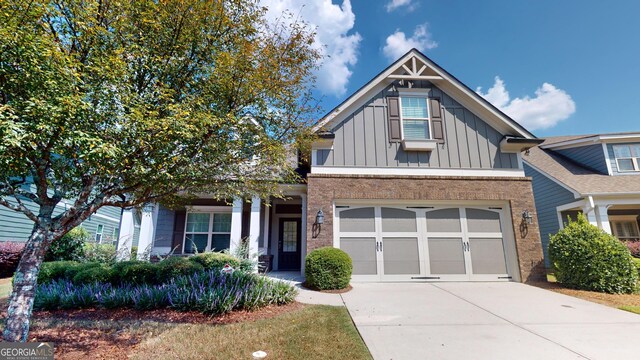 view of front of property with a garage and covered porch