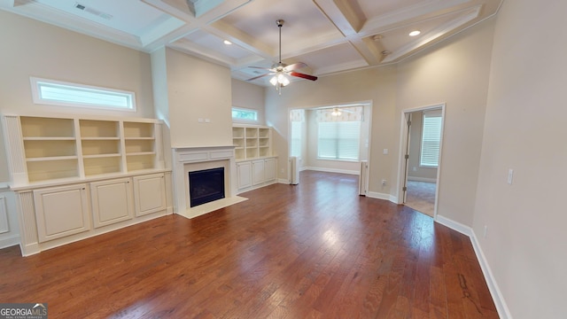 unfurnished living room featuring a ceiling fan, visible vents, coffered ceiling, baseboards, and wood-type flooring