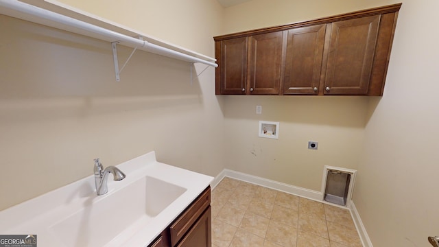 washroom featuring baseboards, washer hookup, cabinet space, electric dryer hookup, and a sink