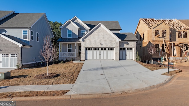 view of front of property with a garage and a porch