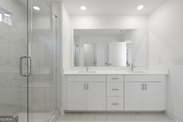 bathroom with walk in shower and vanity