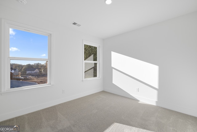 unfurnished room with carpet floors