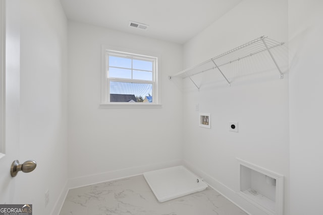 clothes washing area featuring hookup for a washing machine and electric dryer hookup