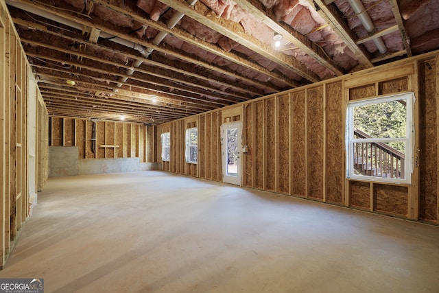 miscellaneous room with concrete flooring and plenty of natural light