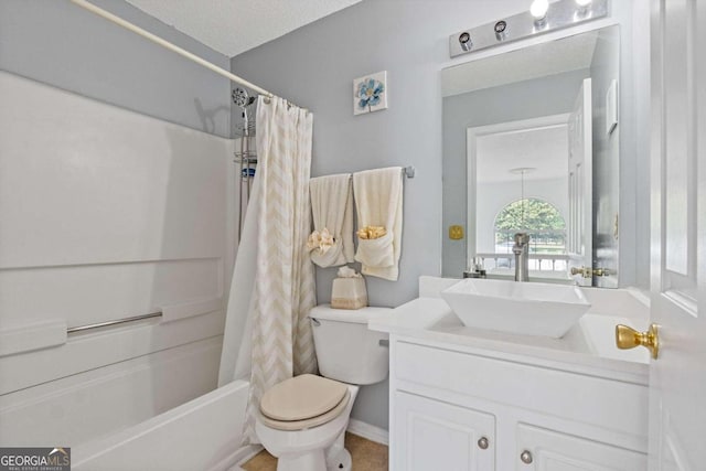 full bathroom with toilet, shower / tub combo with curtain, a textured ceiling, and vanity