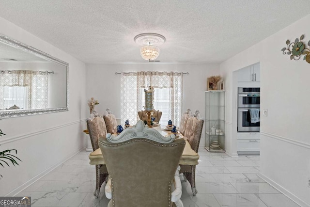 dining area with a textured ceiling