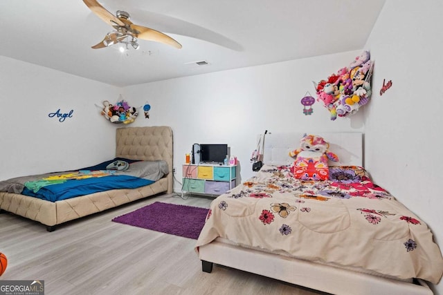 bedroom featuring ceiling fan and hardwood / wood-style floors