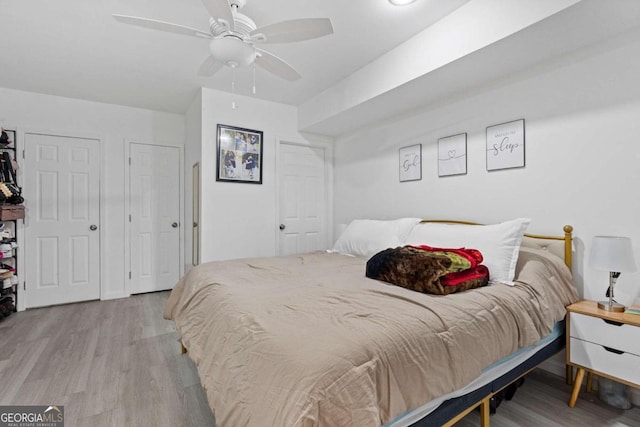 bedroom featuring light hardwood / wood-style flooring and ceiling fan