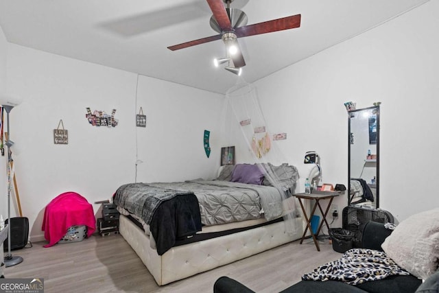 bedroom featuring ceiling fan and light wood-type flooring