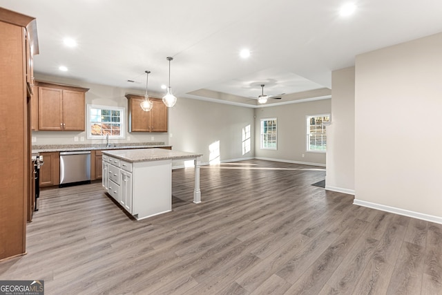 707 Jasmine Dr, Macon, GA 31211 - kitchen featuring stainless steel dishwasher, recessed lighting, open floor plan, a breakfast bar area, and light wood-style floors