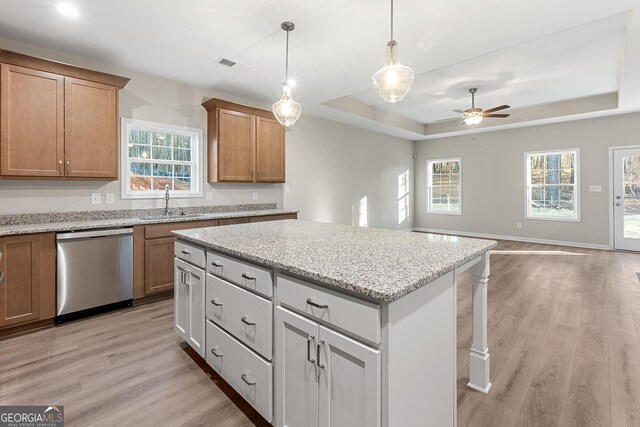 707 Jasmine Dr, Macon, GA 31211 - kitchen with dishwasher, light wood-style floors, a raised ceiling, and a ceiling fan