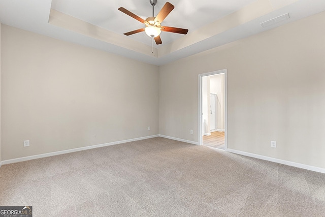 707 Jasmine Dr, Macon, GA 31211 - carpeted spare room with a ceiling fan, baseboards, and a tray ceiling