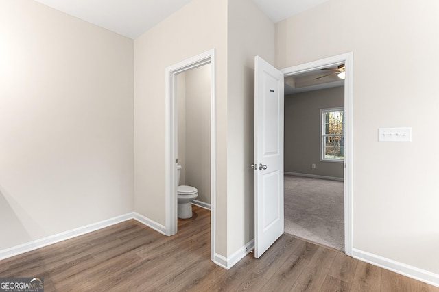 707 Jasmine Dr, Macon, GA 31211 - bathroom with wood finished floors, toilet, ceiling fan, and baseboards