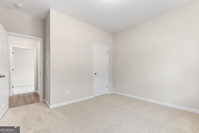 707 Jasmine Dr, Macon, GA 31211 - unfurnished bedroom with carpet floors and baseboards