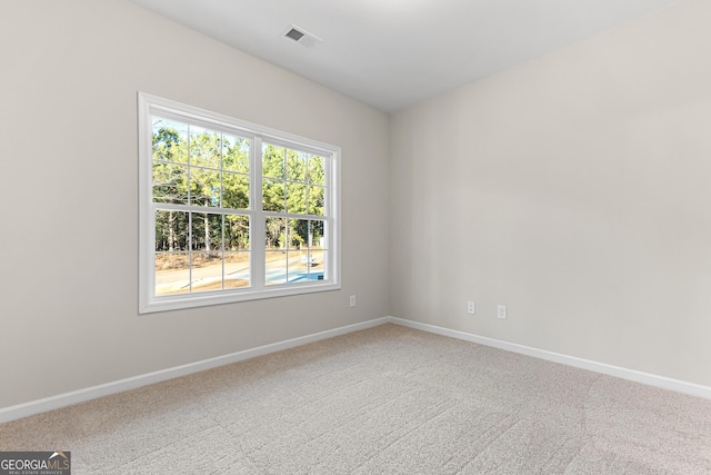 707 Jasmine Dr, Macon, GA 31211 - carpeted empty room with plenty of natural light and baseboards