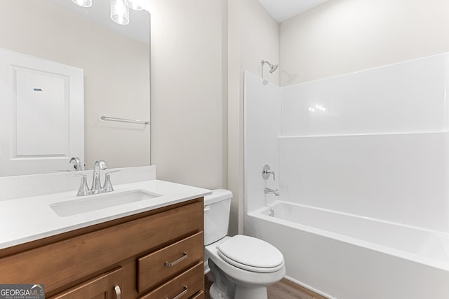 707 Jasmine Dr, Macon, GA 31211 - bathroom featuring toilet, vanity, shower / tub combination, and wood finished floors