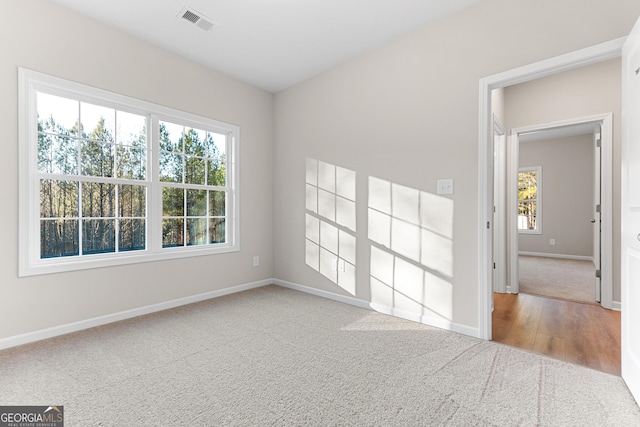 707 Jasmine Dr, Macon, GA 31211 - carpeted empty room with baseboards and wood finished floors
