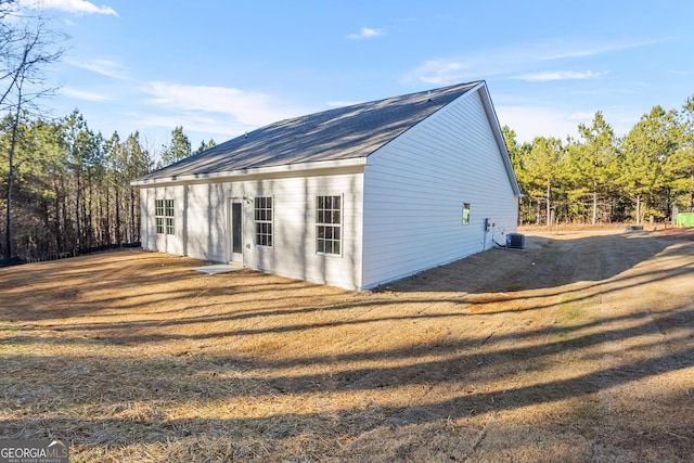 707 Jasmine Dr, Macon, GA 31211 - rear view of house with central AC unit and roof with shingles