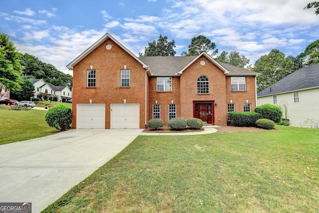 view of front of property with a garage and a front yard