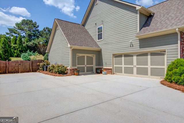 back of house with a garage