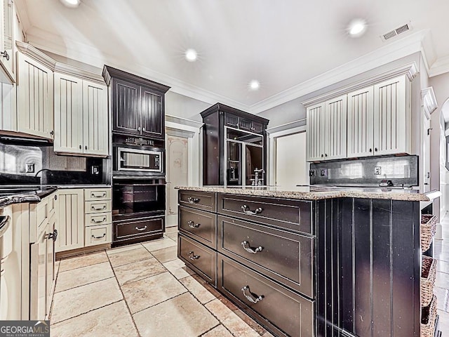 kitchen with built in appliances, decorative backsplash, crown molding, recessed lighting, and light stone countertops
