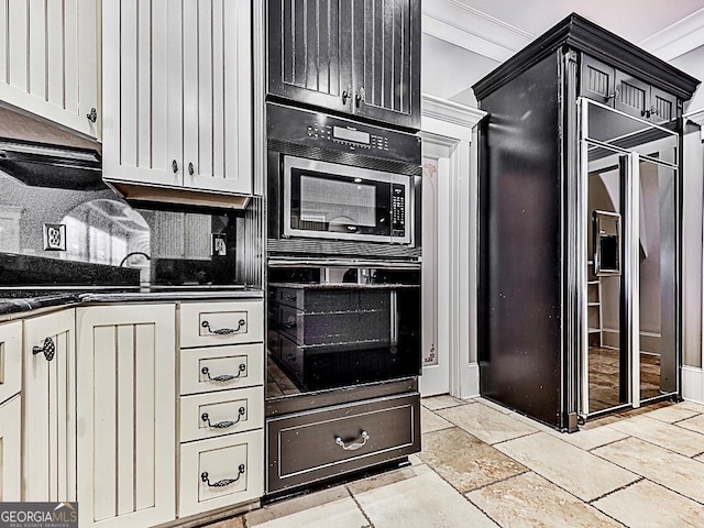 kitchen with double oven, ornamental molding, decorative backsplash, and white cabinetry