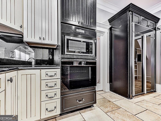 kitchen featuring black appliances, ornamental molding, stone tile floors, and decorative backsplash