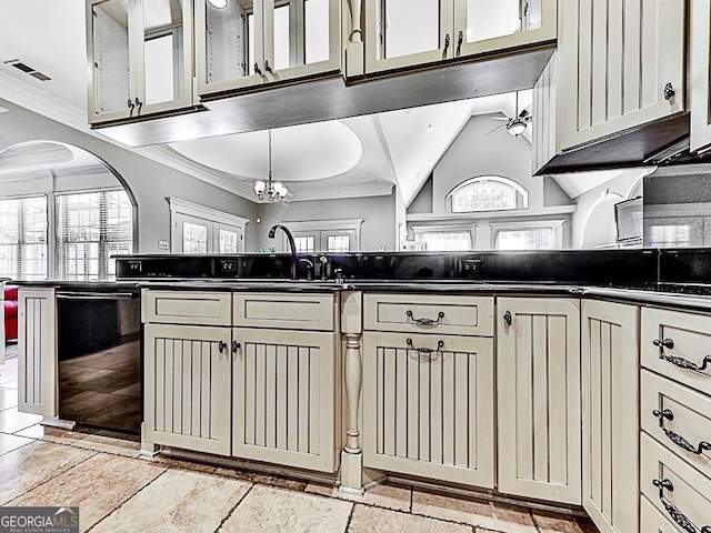 kitchen featuring hanging light fixtures, crown molding, ceiling fan with notable chandelier, black dishwasher, and cream cabinetry