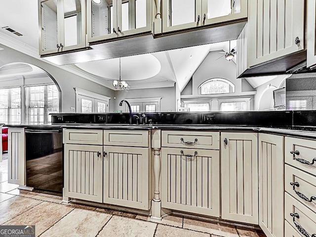 kitchen featuring black dishwasher, crown molding, ceiling fan, dark countertops, and arched walkways