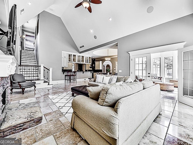 living room featuring ceiling fan, high vaulted ceiling, stairway, recessed lighting, and baseboards
