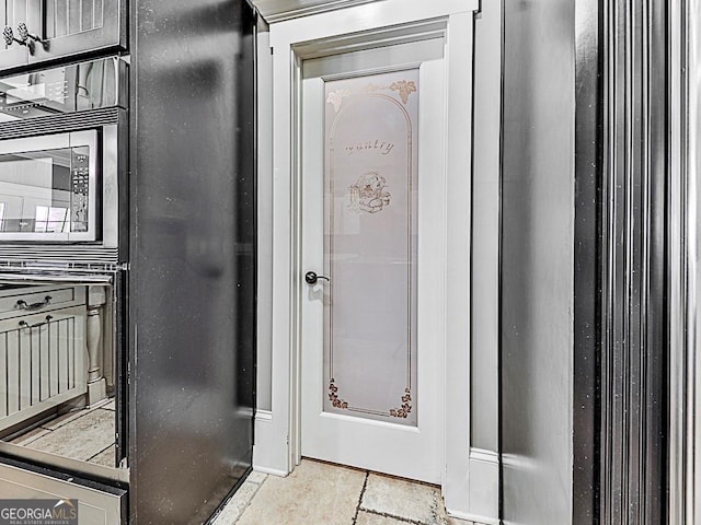 bathroom with tile patterned floors