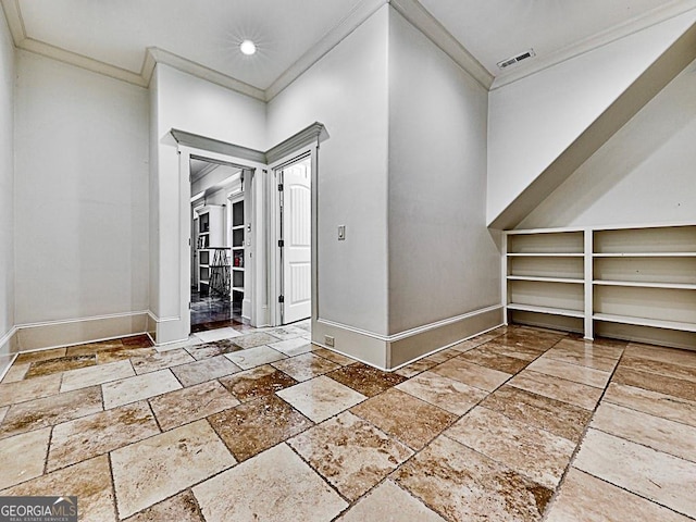 interior space featuring stone tile floors, baseboards, crown molding, and recessed lighting